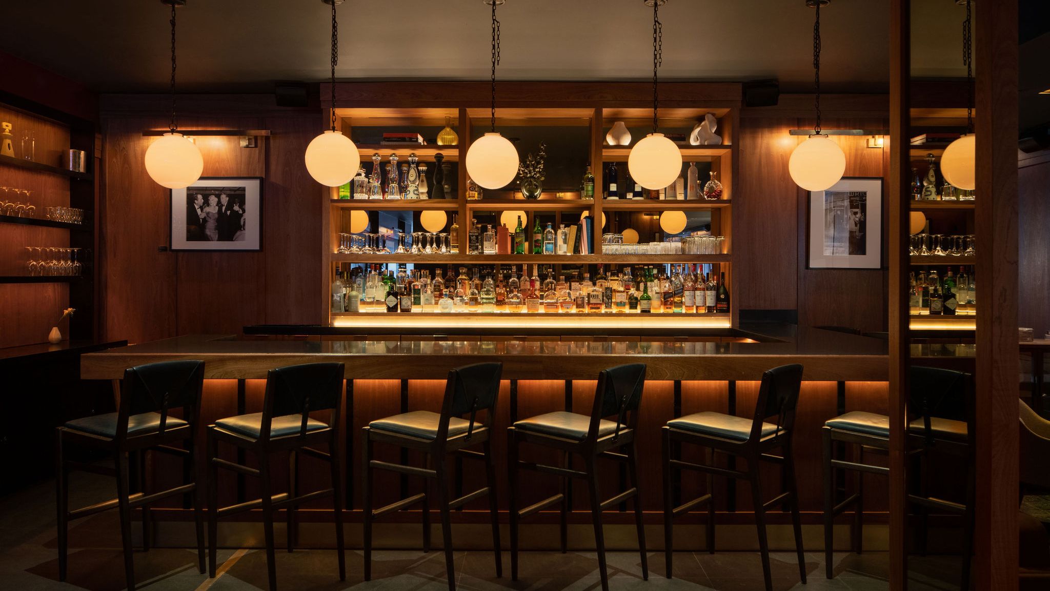 Low-lit bar with globe pendants at Smyth Tribeca